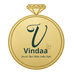 Gold pendant with 'Vindaa' brand logo on a white background
